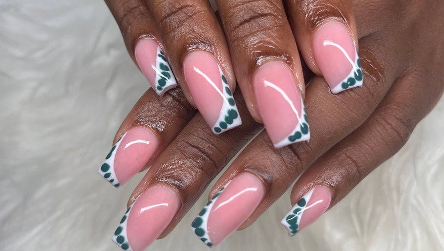 Stylish nail art with pink polish and green accents at Buffed246, Lancaster, Saint James, BB.