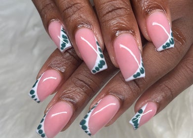 Stylish nail art with pink polish and green accents at Buffed246, Lancaster, Saint James, BB.