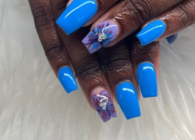 Stylish blue manicure with floral accents at Buffed246, Lancaster, Saint James, BB.