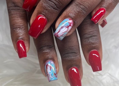 Stunning red nails with marble designs at Buffed246, Lancaster, Saint James, BB.