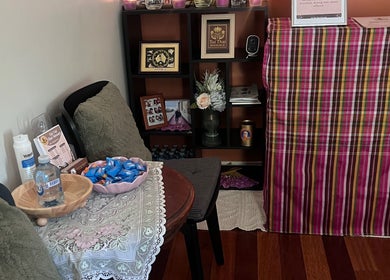 Inviting waiting area at Tui Nui Thai Massage in Bowden, South Australia, AU, with chairs and decor.