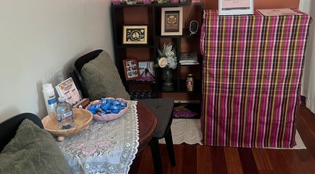 Inviting waiting area at Tui Nui Thai Massage in Bowden, South Australia, AU, with chairs and decor.