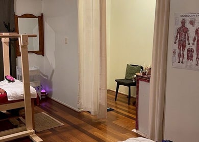 Calming massage room at Tui Nui Thai Massage in Bowden, South Australia, AU with anatomical poster.