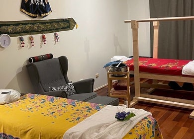 Cozy massage room at Tui Nui Thai Massage in Bowden, South Australia, AU with colorful decor and massage beds.