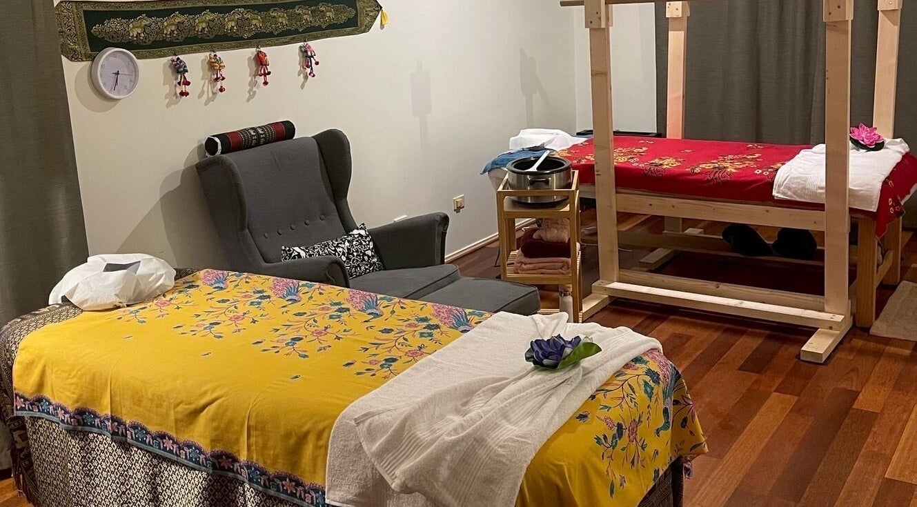 Cozy massage room at Tui Nui Thai Massage, Bowden, South Australia, AU featuring vibrant, decorated beds.