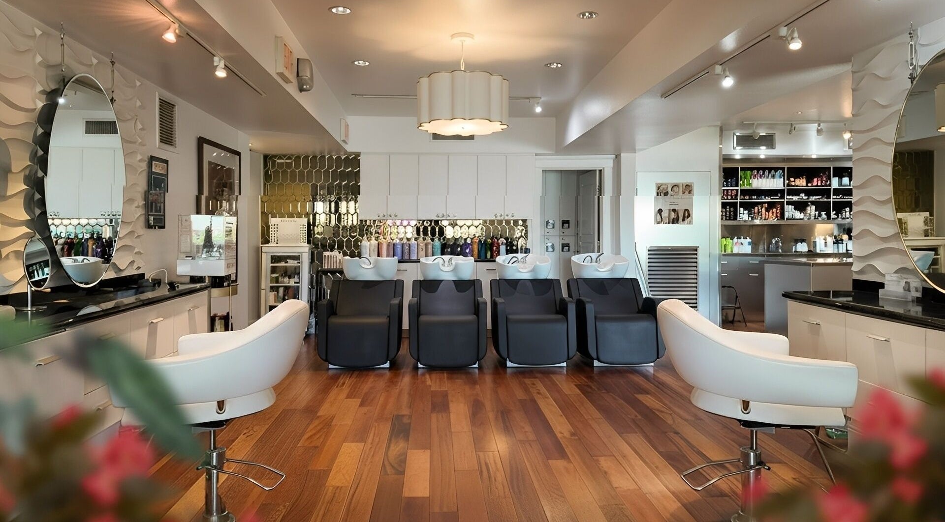 Elegant salon interior at The Grand Beauty Spa, Tampa, Florida, US, featuring modern styling chairs and decor.