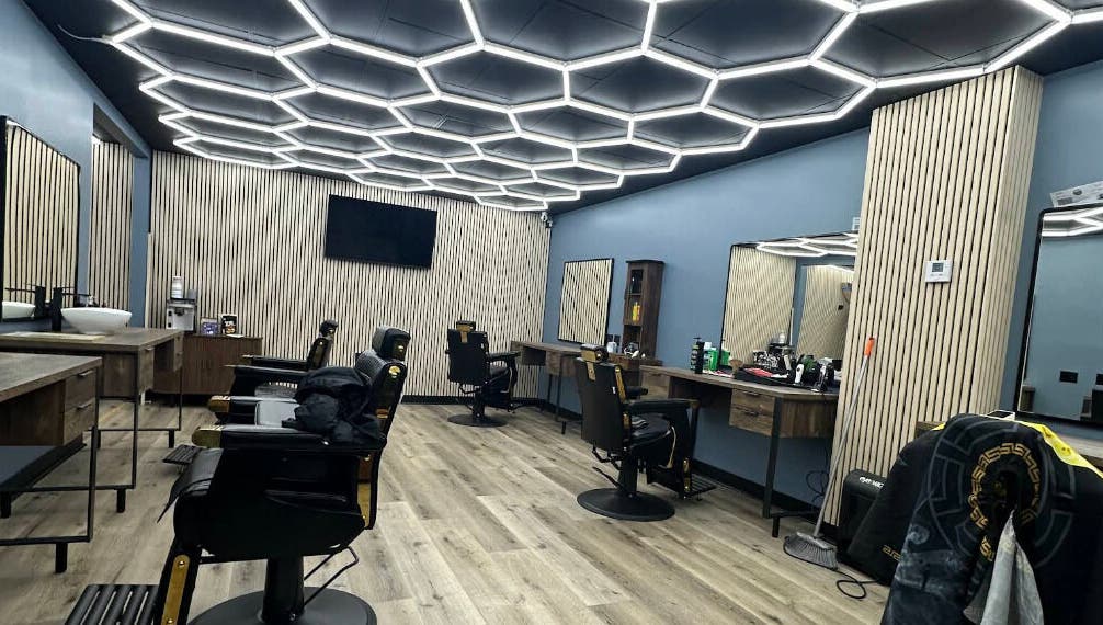 Stylish interior of G barbershop in Glendale, California, US featuring sleek salon chairs and modern decor.