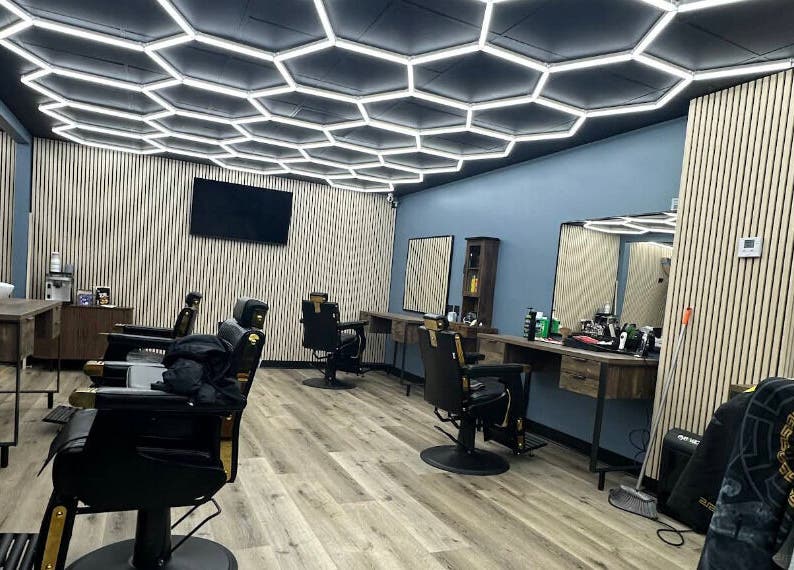 Stylish interior of G barbershop in Glendale, California, US featuring sleek salon chairs and modern decor.