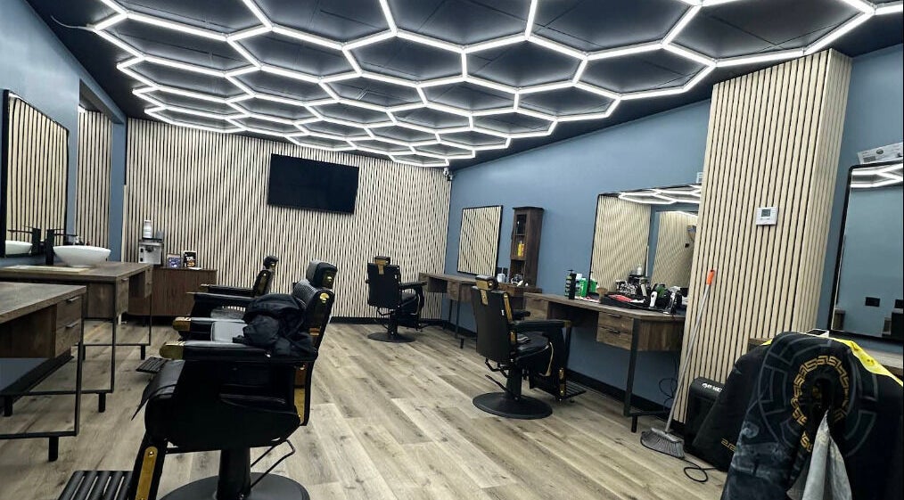 Stylish interior of G barbershop in Glendale, California, US featuring sleek salon chairs and modern decor.