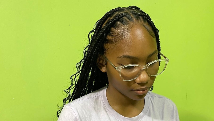 Stylish braided hairstyle at Tressed By Jai in Roseau, Saint George Parish, DM. Perfect for a chic, modern look.