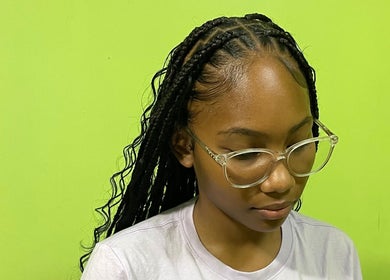 Stylish braided hairstyle at Tressed By Jai in Roseau, Saint George Parish, DM. Perfect for a chic, modern look.