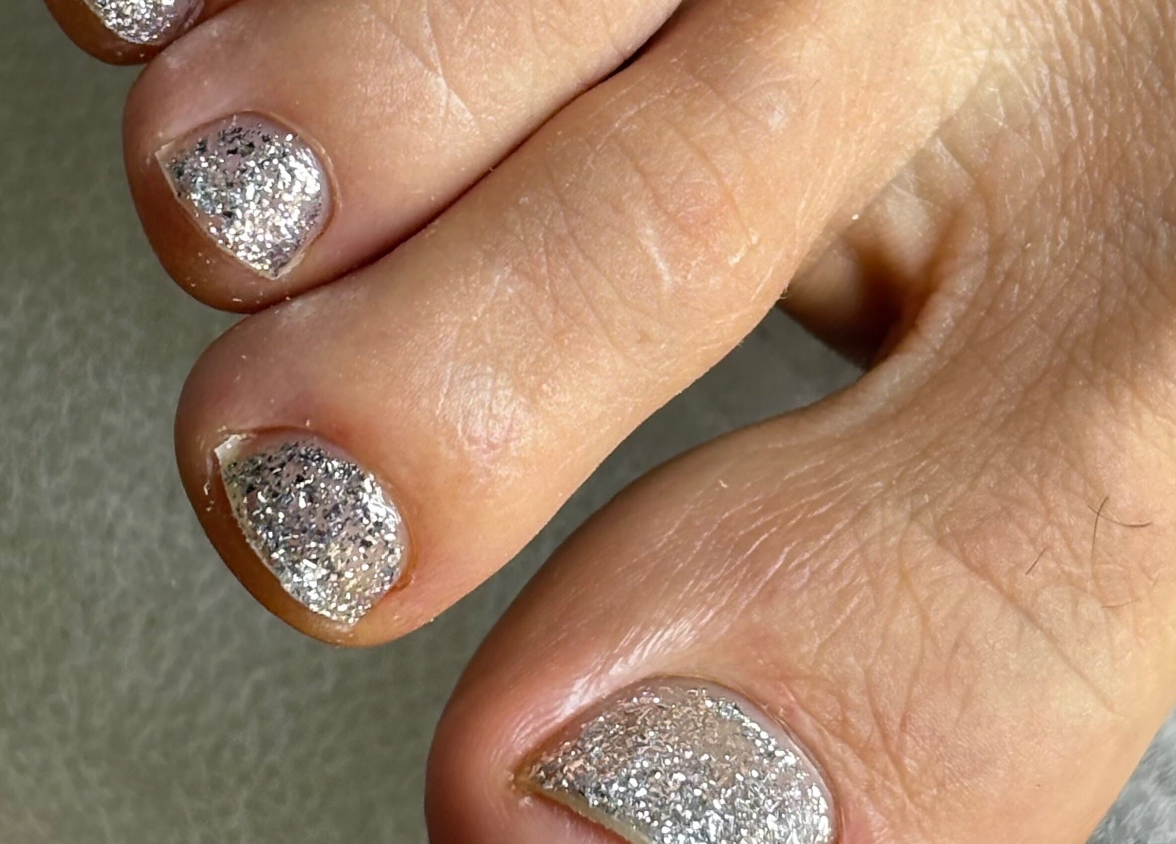 Elegant glitter toenail polish at Serenity Nails, located in Chang Wat Surat Thani, Chang Wat Surat Thani, TH.