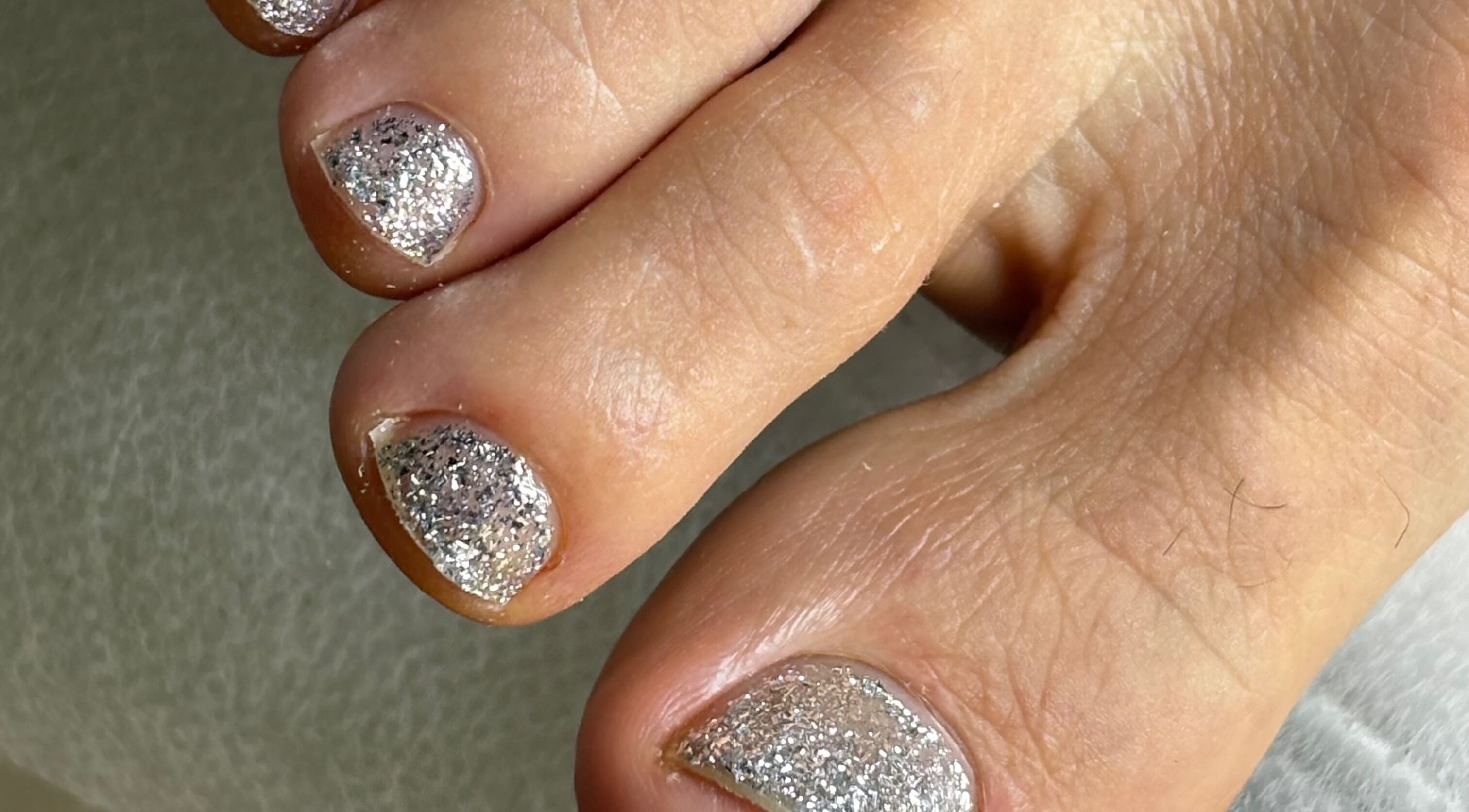 Elegant glitter toenail polish at Serenity Nails, located in Chang Wat Surat Thani, Chang Wat Surat Thani, TH.