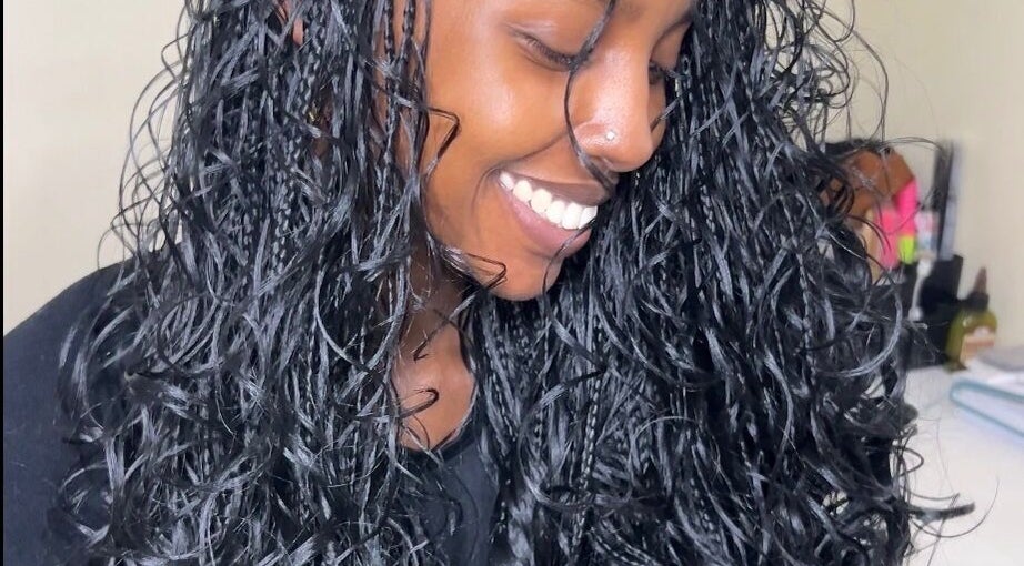 Woman's radiant, curly hair styled at Olutey in Toronto, Ontario, CA.