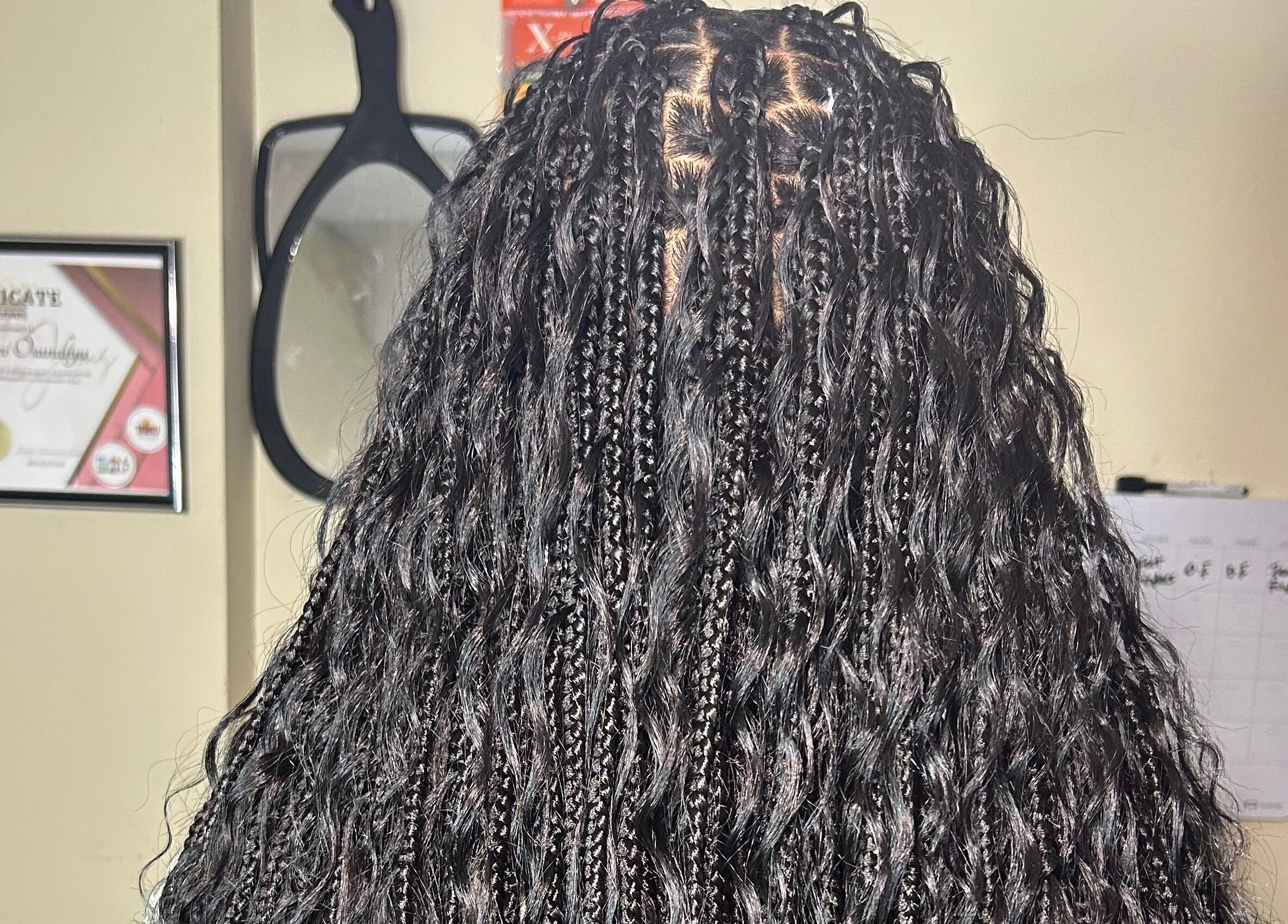 Intricate braided hairstyle at Olutey, Toronto, Ontario, CA, showcasing expert craftsmanship and style.