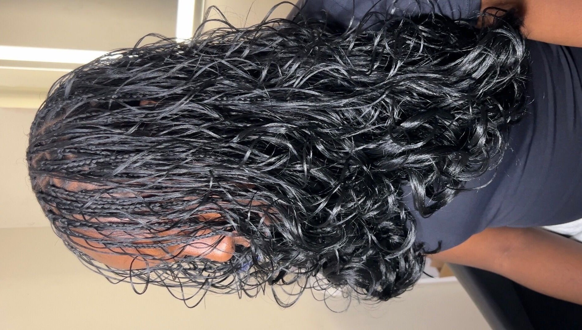 Close-up of elegant braided hairstyle at Olutey, Toronto, Ontario, CA. Perfect for enhancing natural beauty.