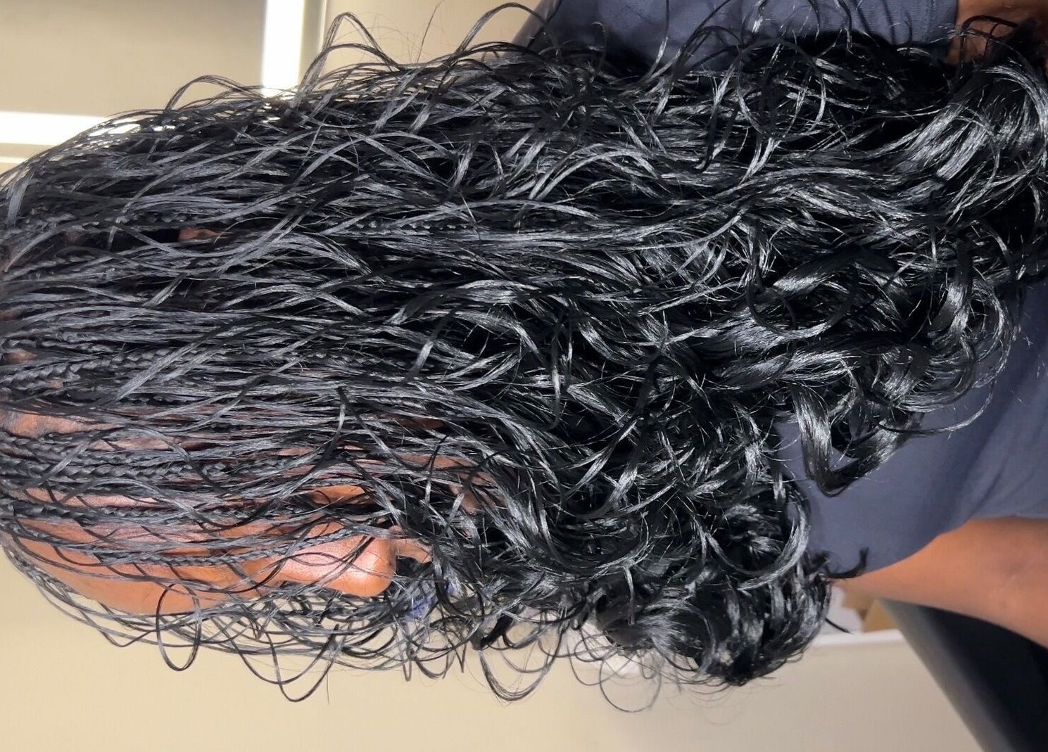 Close-up of elegant braided hairstyle at Olutey, Toronto, Ontario, CA. Perfect for enhancing natural beauty.