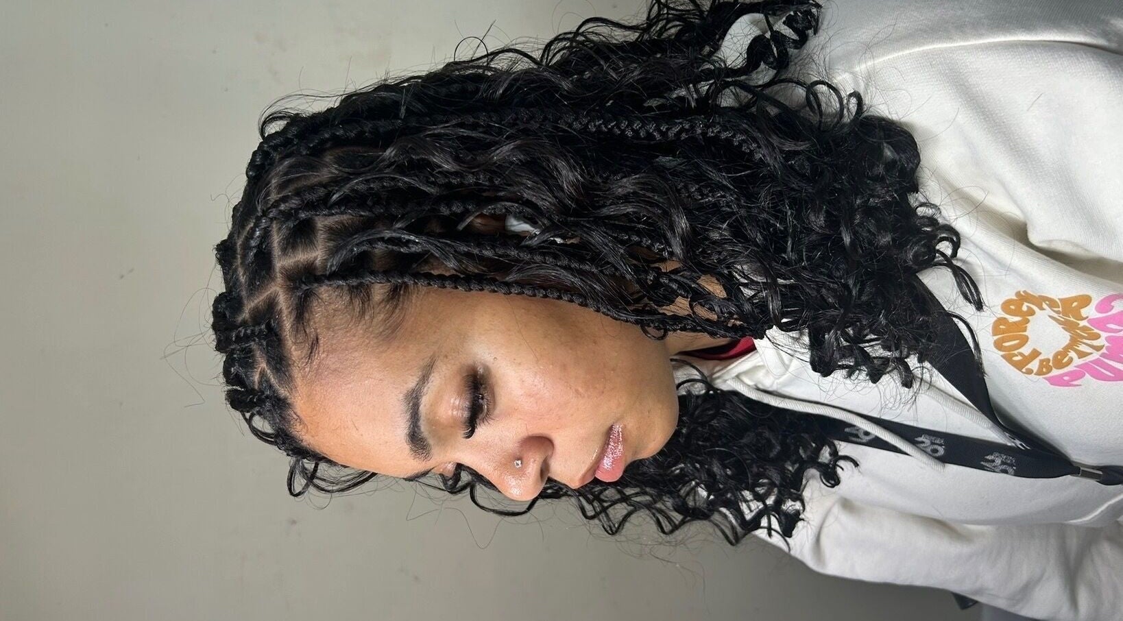 Intricate braided hairstyle at Olutey in Toronto, Ontario, CA showcasing detailed curl patterns.