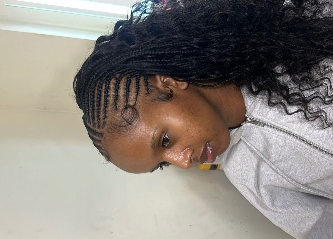 Stylish braided hairstyle at Olutey in Toronto, Ontario, CA. Perfect look for beauty and wellness.