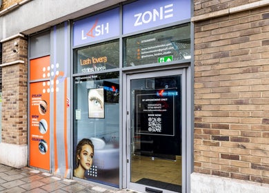 Entrance of Lash Zone London showcasing modern signage and window displays, located in London, England, GB.