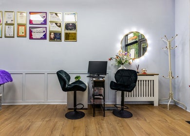 Elegant interior of Lash Zone London in London, England, GB, featuring a styling station with velvet chairs.