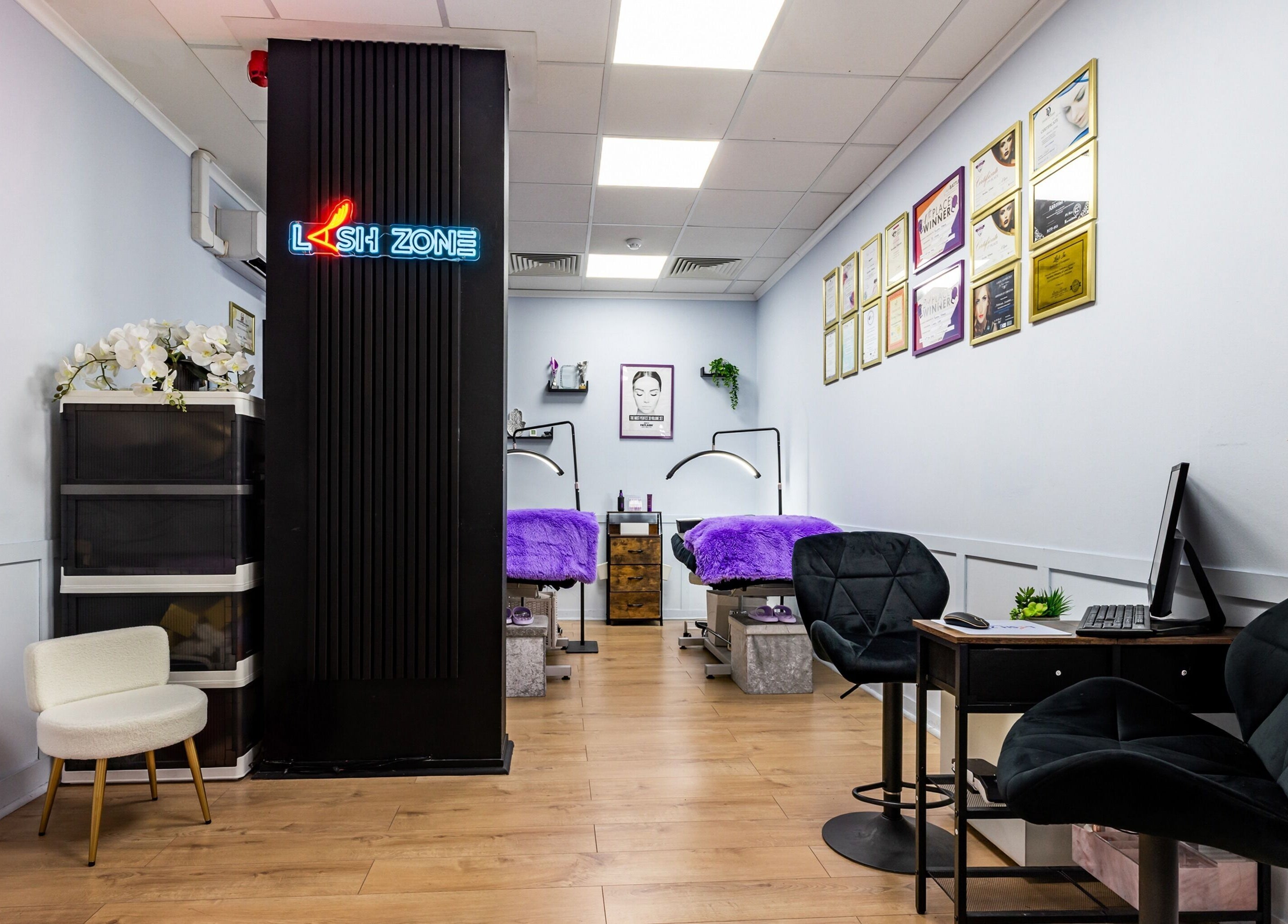 Interior view of Lash Zone London, a serene beauty studio in London, England, GB, showcasing stylish decor and treatment areas.