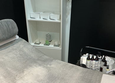 Tranquil treatment room at GB Skin and Laser Salon, Forfar, Scotland, GB with cozy massage table and skincare products.