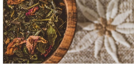 Herbal blend in wooden bowl at KB Herbs, County Galway, IE, exuding natural wellness and organic beauty.
