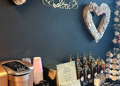 LC Beauty Bar's elegant coffee station with floral decor in Apopka, Florida, US.