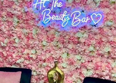LC Beauty Bar's floral wall with neon sign in Apopka, Florida, US.