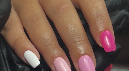 Colorful manicured nails in pink and white at beautybymia, Nettleham, England, GB.