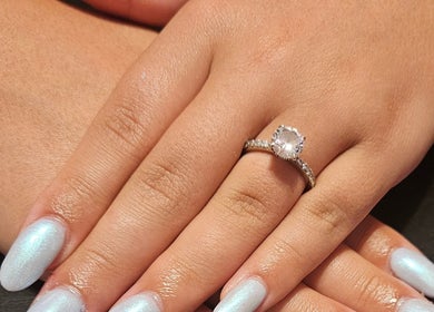 Elegant pearl nails with a sparkling ring at Nailed it Nails, Waupun, Wisconsin, US.