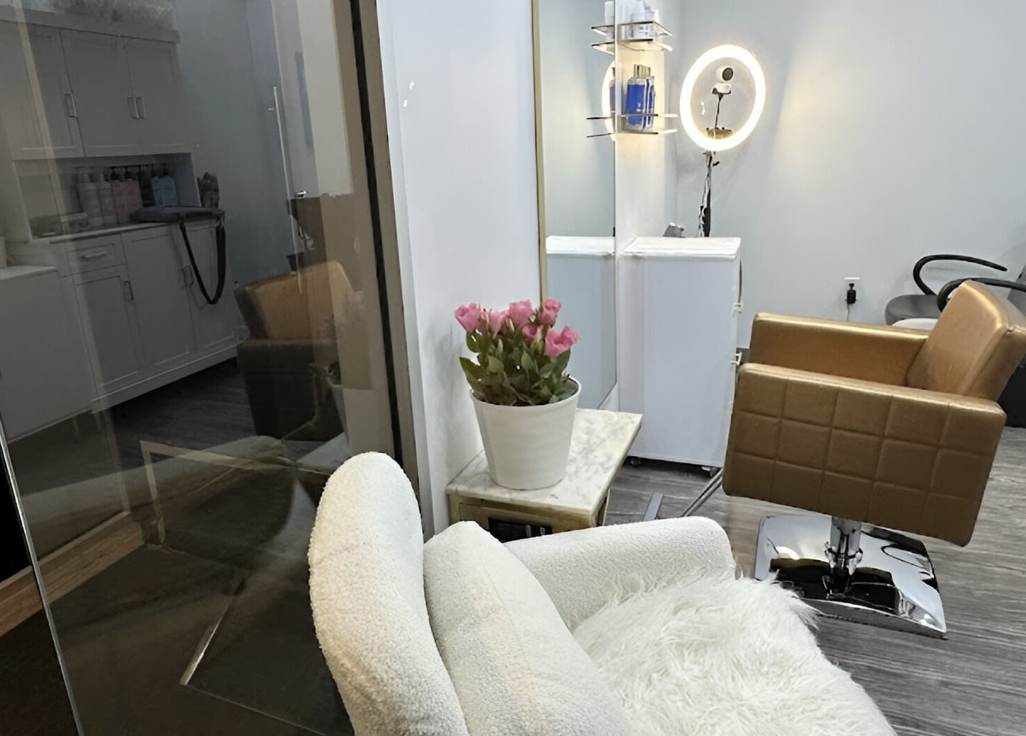 Inside Lucas Hair Loft in Tampa, Florida, US, featuring stylish chairs and a cozy, elegant setting.