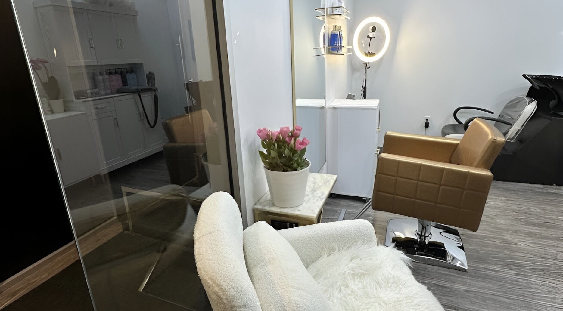 Inside Lucas Hair Loft in Tampa, Florida, US, featuring stylish chairs and a cozy, elegant setting.