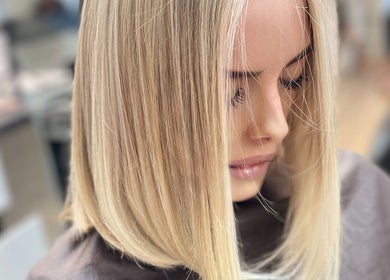 Blonde hair styled at Lucas Hair Loft, Tampa, Florida, US, showcasing smooth, sleek finish.