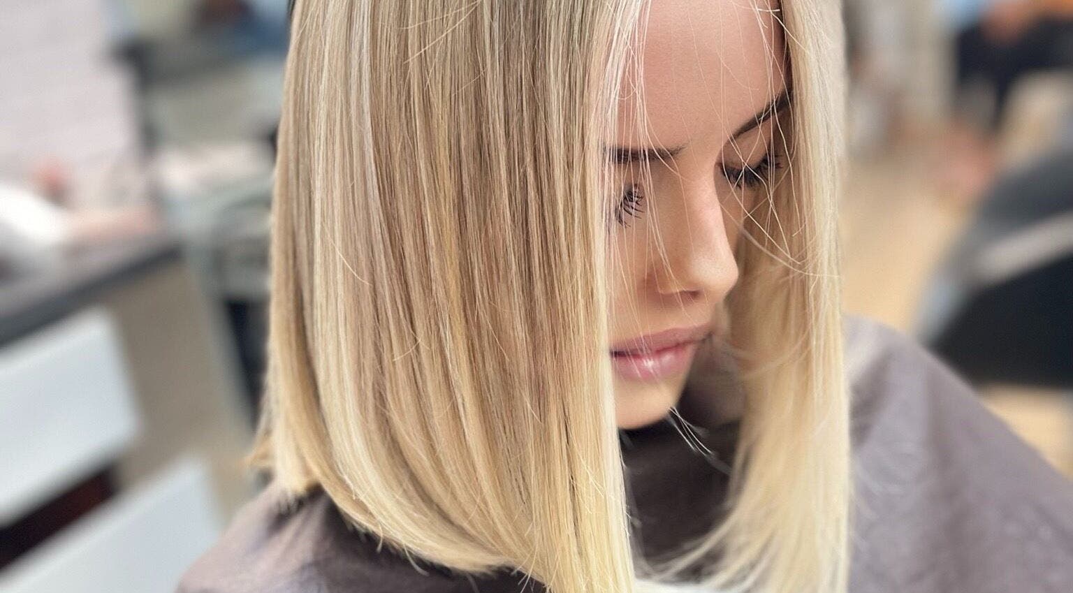Blonde hair styled at Lucas Hair Loft, Tampa, Florida, US, showcasing smooth, sleek finish.