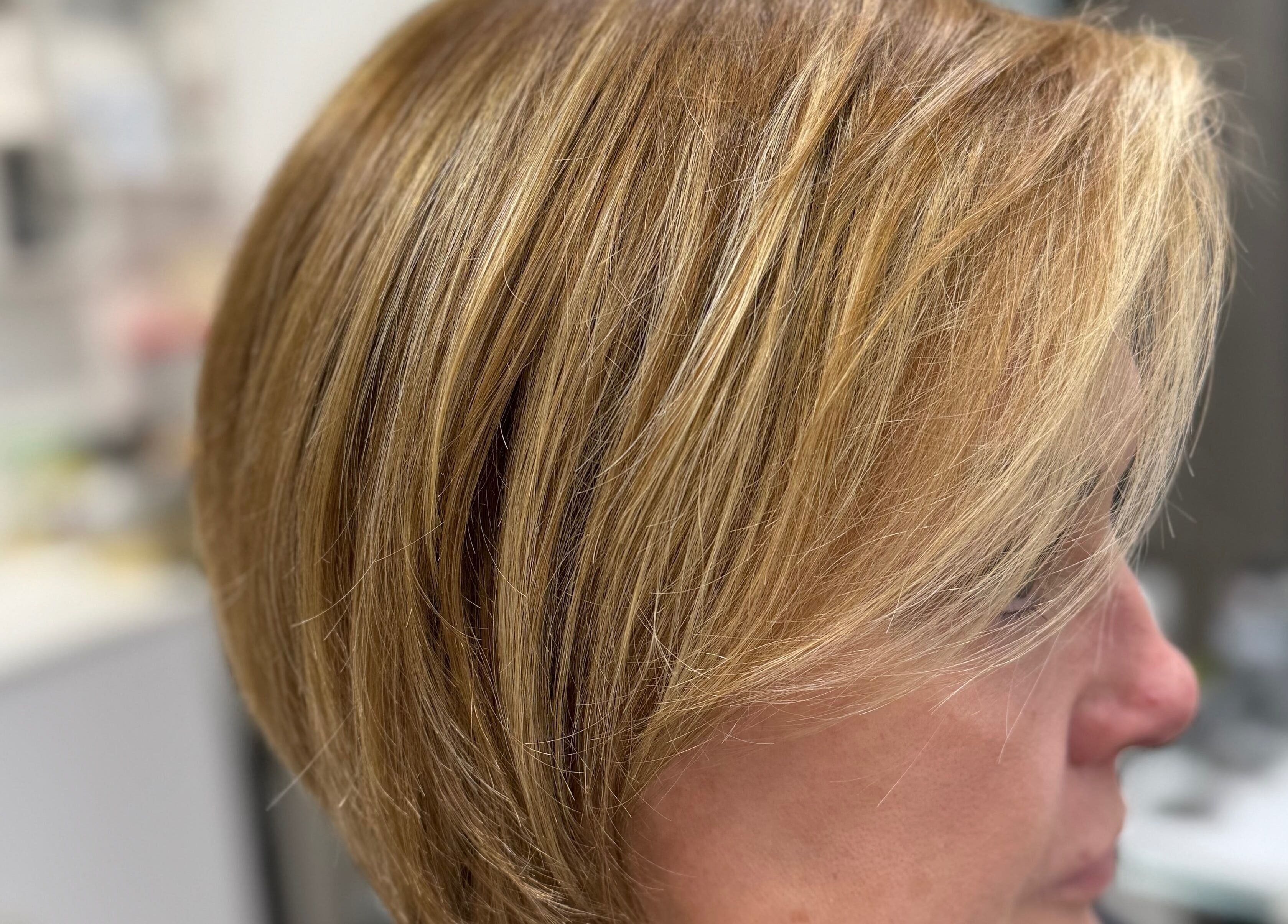 Stylish blonde bob hairstyle at Lucas Hair Loft in Tampa, Florida, US, showcasing expert hair styling.