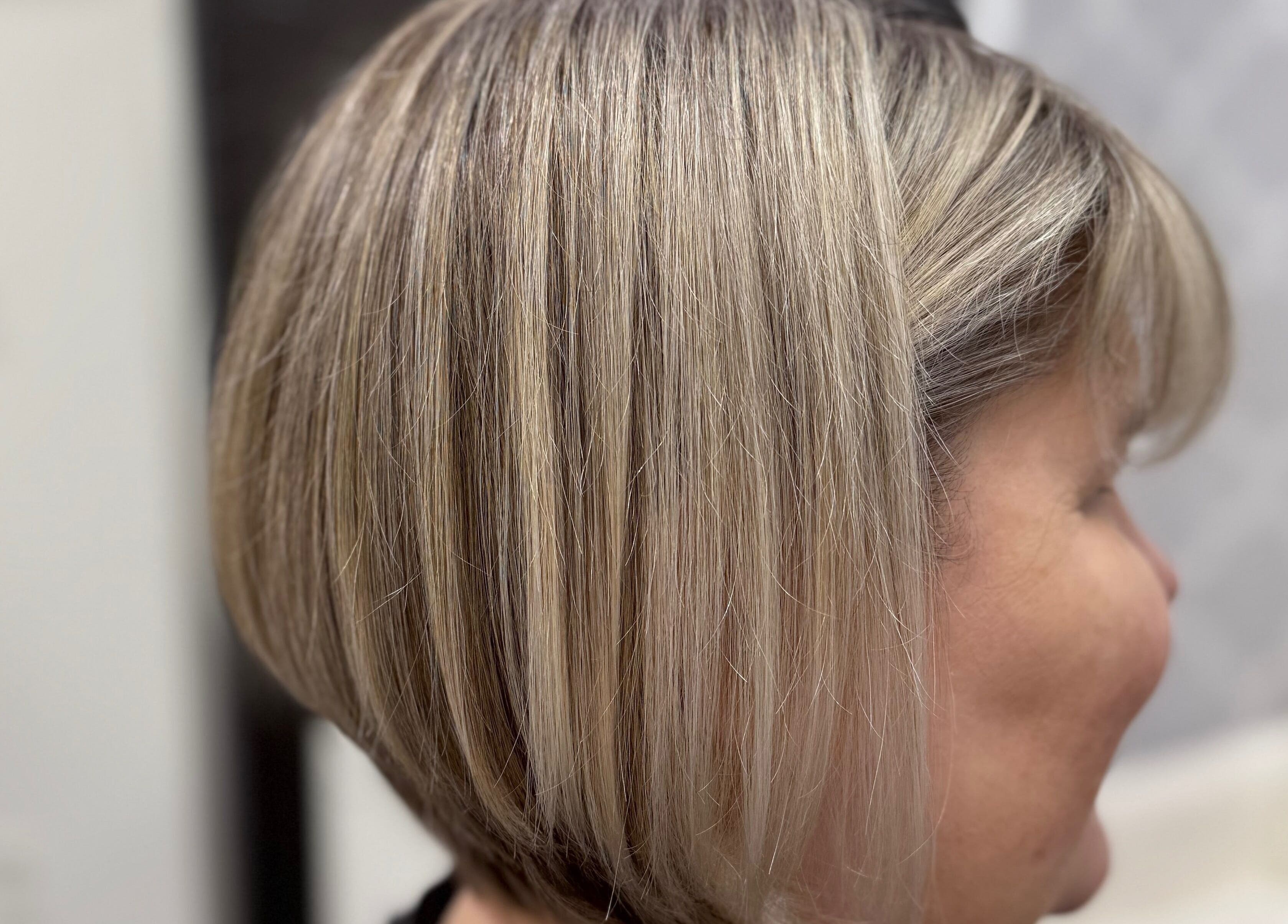 Stylish blonde bob haircut showcased at Lucas Hair Loft in Tampa, Florida, US.