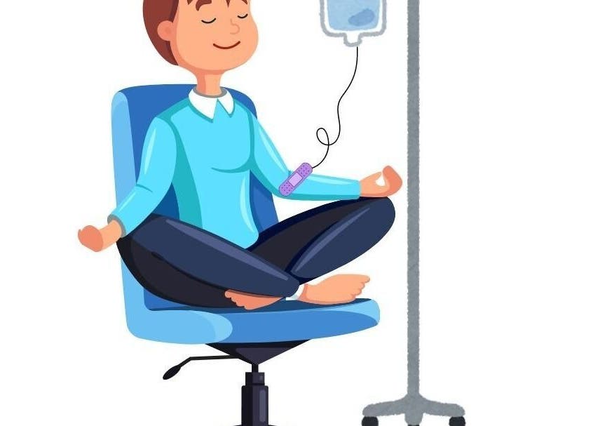 Person meditating during IV therapy at Centered IV Therapy Tyler, TX, in Tyler, Texas, US, ensuring relaxation.