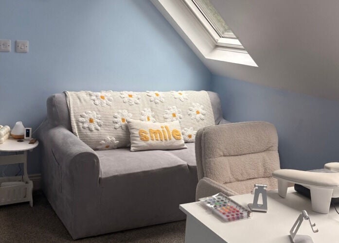 Comfortable nail treatment area at Nails and Beauty by Abi, Ramsey, Ramsey, IM with sofa and manicure setup.