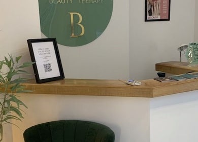 Welcoming reception area at House of Refine, Nottingham, England, GB, with elegant decor and greenery.