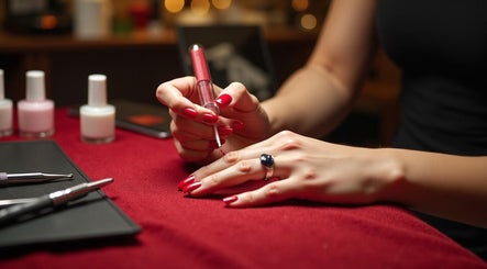 Nail technician applying polish at GlanzNägel in Berlin, Berlin, DE.