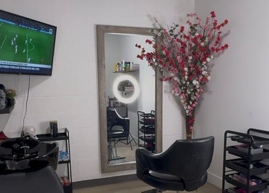 Elegant interior of Mango Hair Studio in Toronto, Ontario, CA featuring a stylish salon chair and decor.