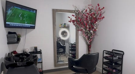 Elegant interior of Mango Hair Studio in Toronto, Ontario, CA featuring a stylish salon chair and decor.