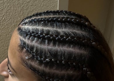Intricate cornrows hairstyle crafted at SlayedbyGracy, Wahiawa, Hawaii, US, showcasing expert braiding.