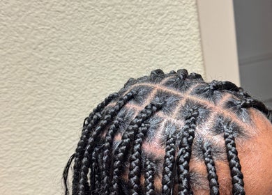 Intricate braided hairstyle at SlayedbyGracy in Wahiawa, Hawaii, US, showing detailed craftsmanship.