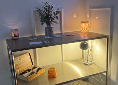 Calm shelf with candles and decor at Kbs Holistic Treatments And Colonic Hydrotherapy, Tiverton, England, GB.