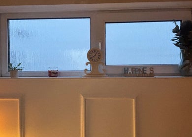 Cozy window display at Kbs Holistic Treatments And Colonic Hydrotherapy, Tiverton, England, GB.