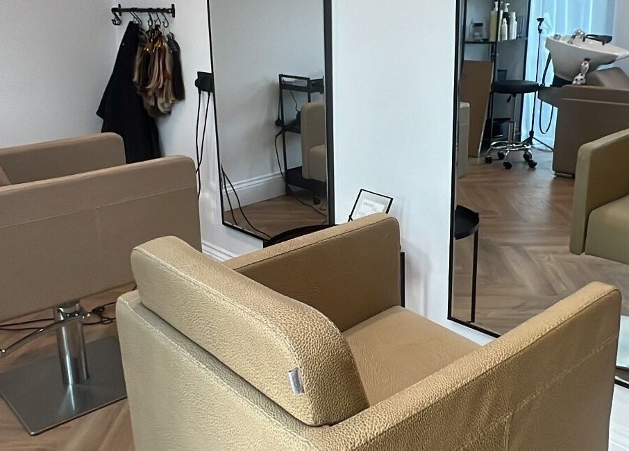 Modern salon chair and mirror at Locks Of Luxury in Portsmouth, England, GB.