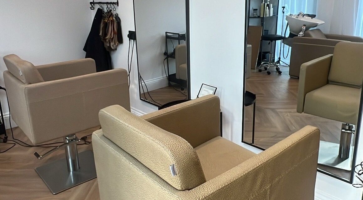 Modern salon chair and mirror at Locks Of Luxury in Portsmouth, England, GB.